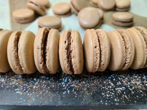 Line of chocolate and peanut butter macarons