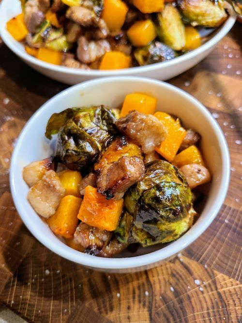 Roasted butternut squash and brussels sprouts with pork belly