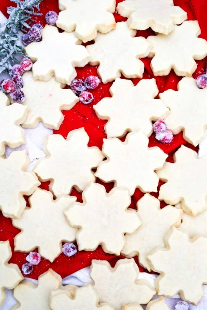 Sugar cookies with sugared cranberries and rosemary