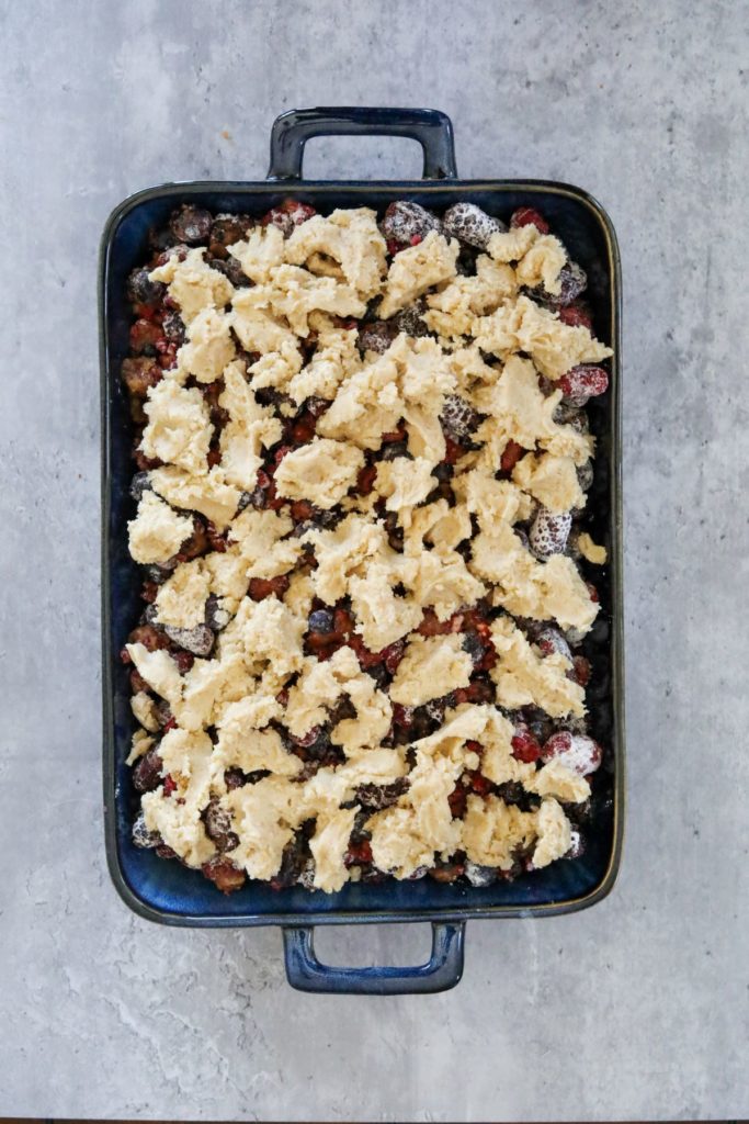 berry cobbler in a baking dish before baking