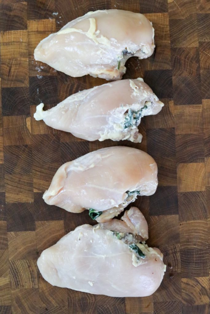 stuffed chicken breasts on a cutting board