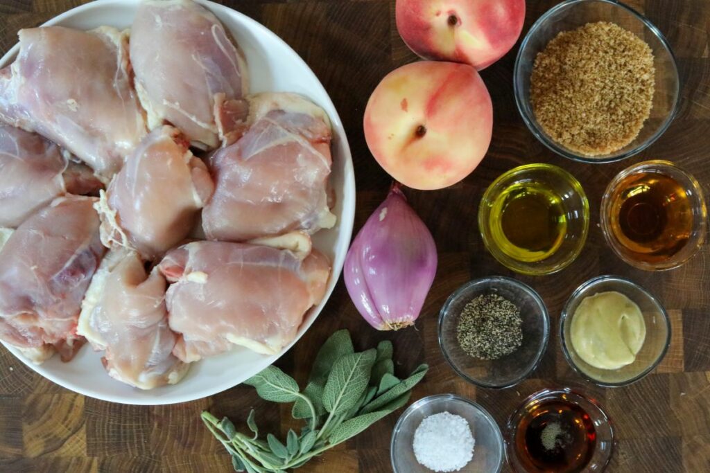 Ingredients for peach chicken on a cutting board.