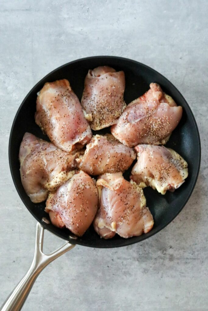 Uncooked chicken in a pan
