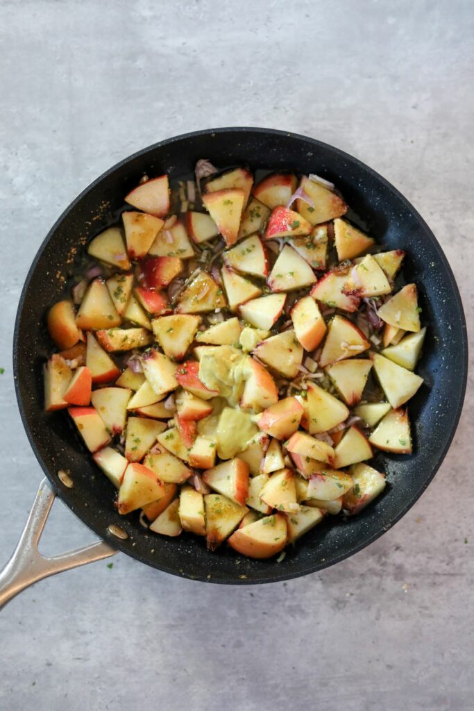Uncooked peach sauce ingredients in a pan