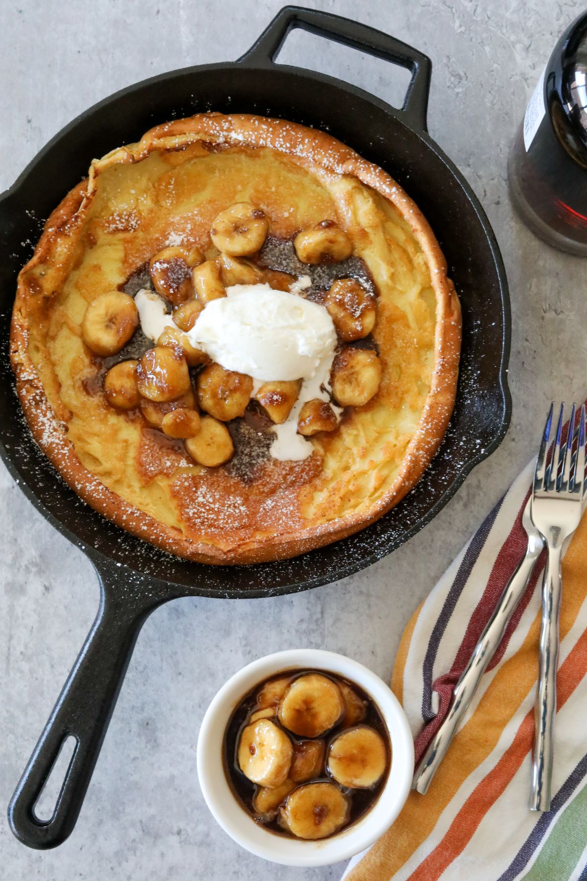 A bananas foster Dutch baby ready to serve