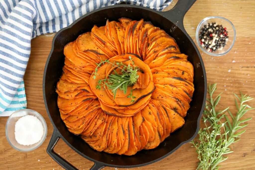 spicy roasted sweet potatoes in a cast iron skillet