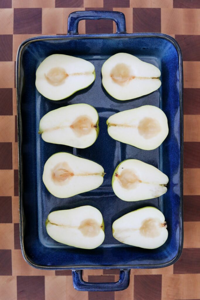 Halved pears in a baking dish