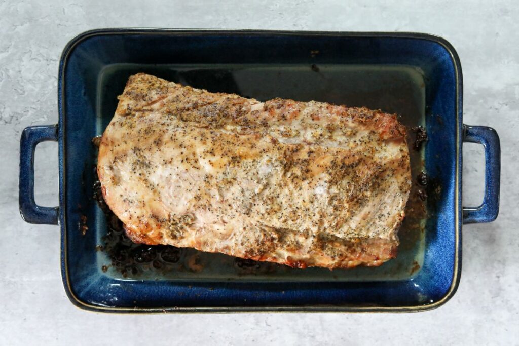 cooked pork loin in a baking dish