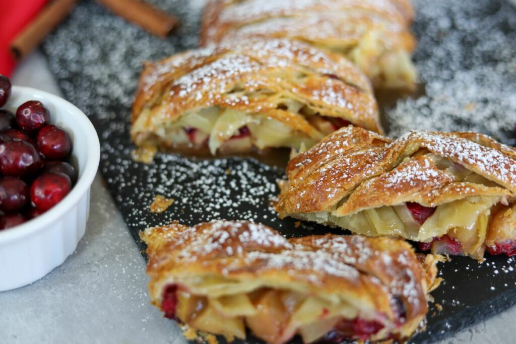 Close up of sliced cranberry and apple strudel
