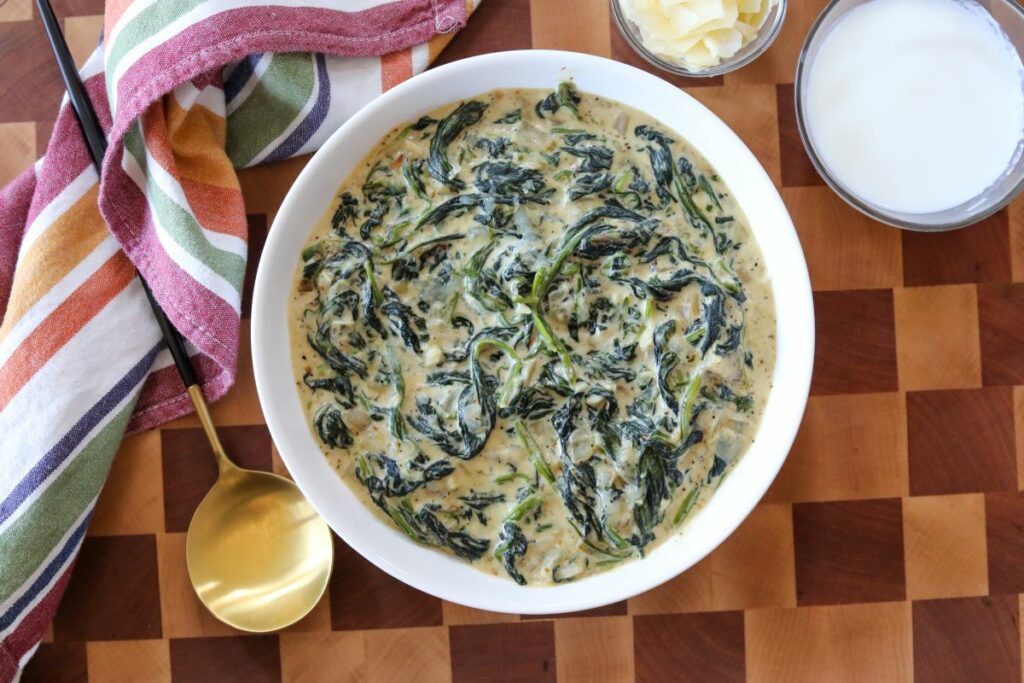 creamed spinach in a white bowl
