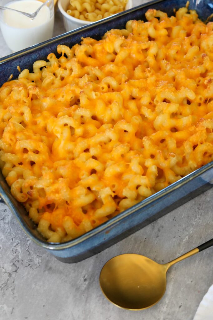 baked macaroni and cheese with serving spoon