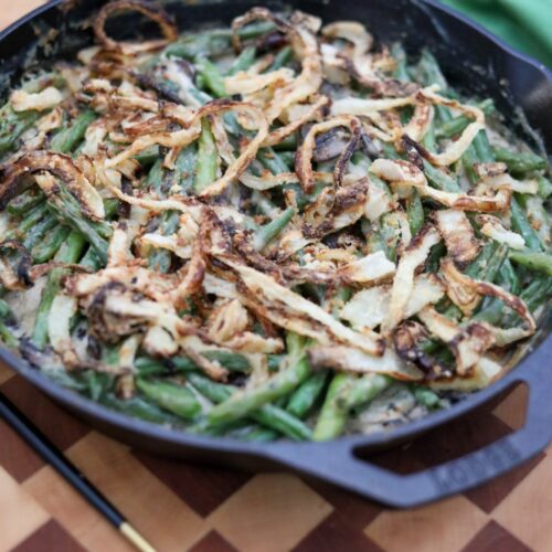 Close up of green bean casserole in a cast iron skillet