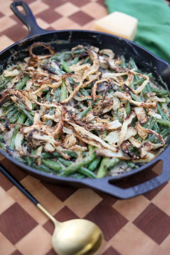 Close up of green bean casserole in a cast iron skillet