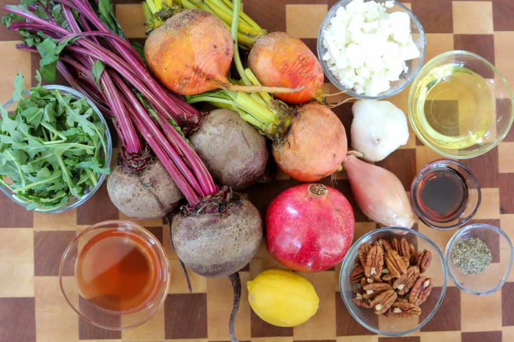 Ingredients for roasted beet salad on a wooden cutting board