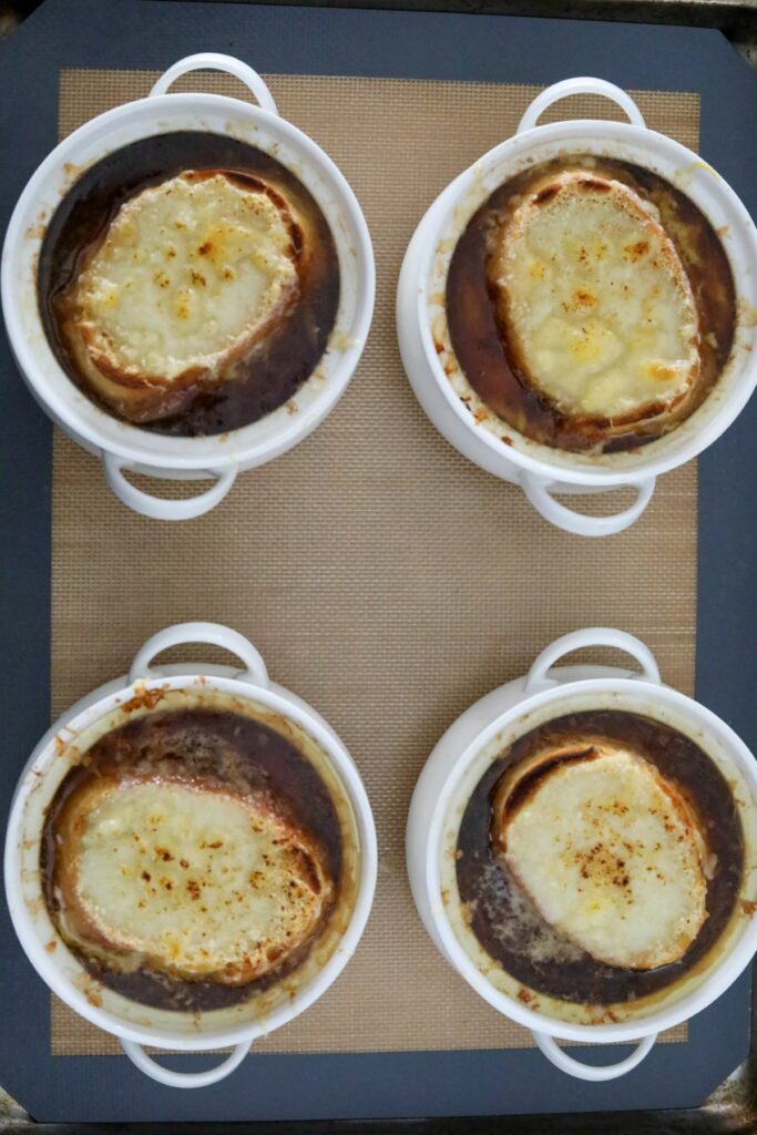 Melted cheese toast on top of French onion soup
