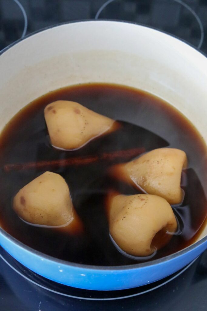 Cooked pears in poaching liquid