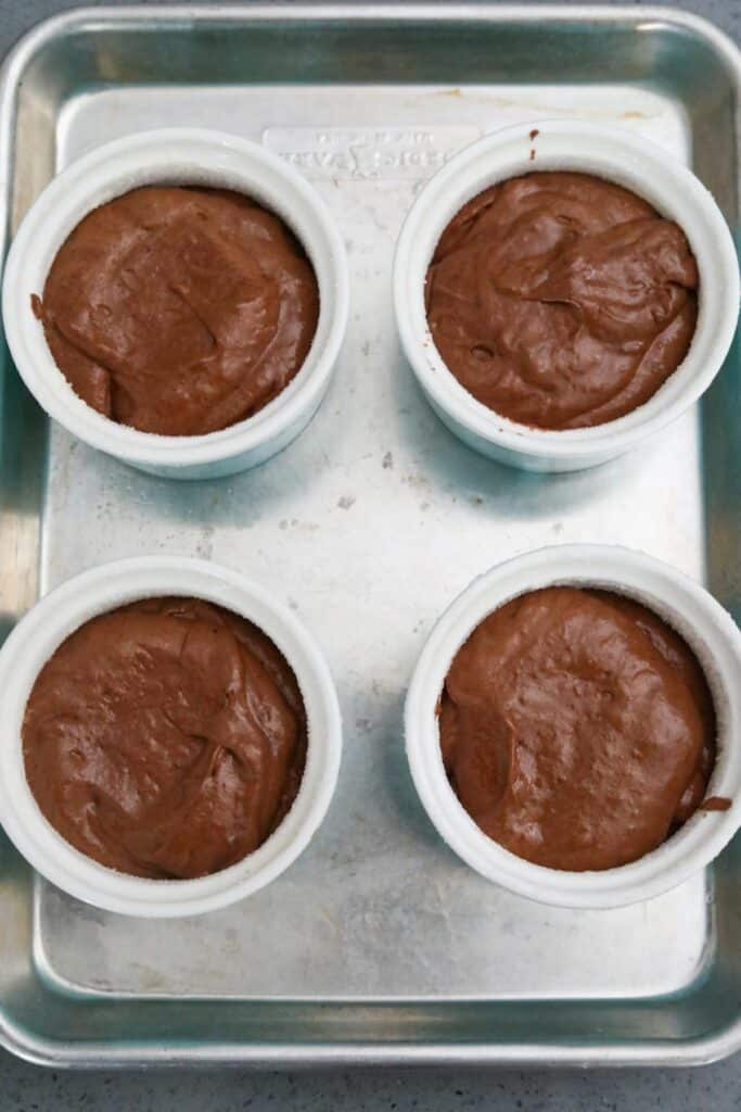 chocolate souffle batter in ramekins
