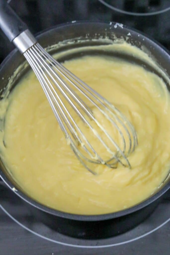 Whisked cooked crème patisserie in a saucepan