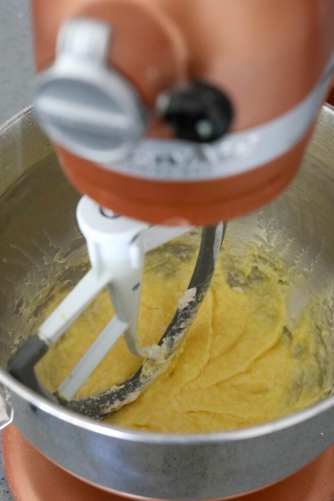Butter mixture with added egg in a mixing bowl