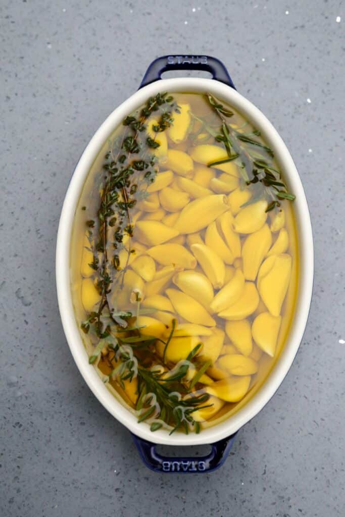 Baking dish with garlic, herbs and olive oil