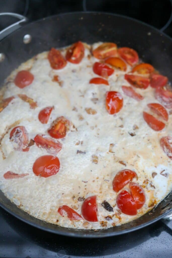 Cream added to the pan with the tomatoes and shallots
