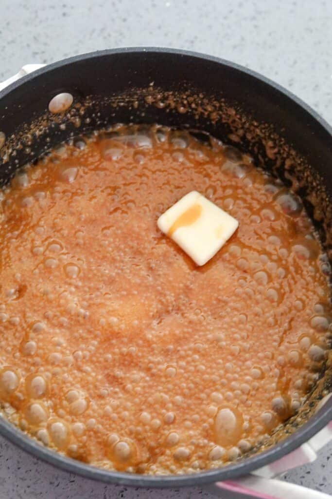 Adding butter to caramel sauce