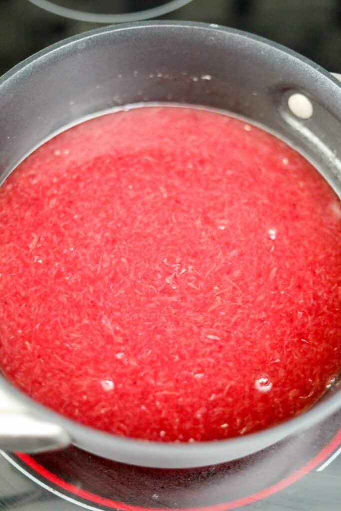 A saucepan with blood orange juice and sugar