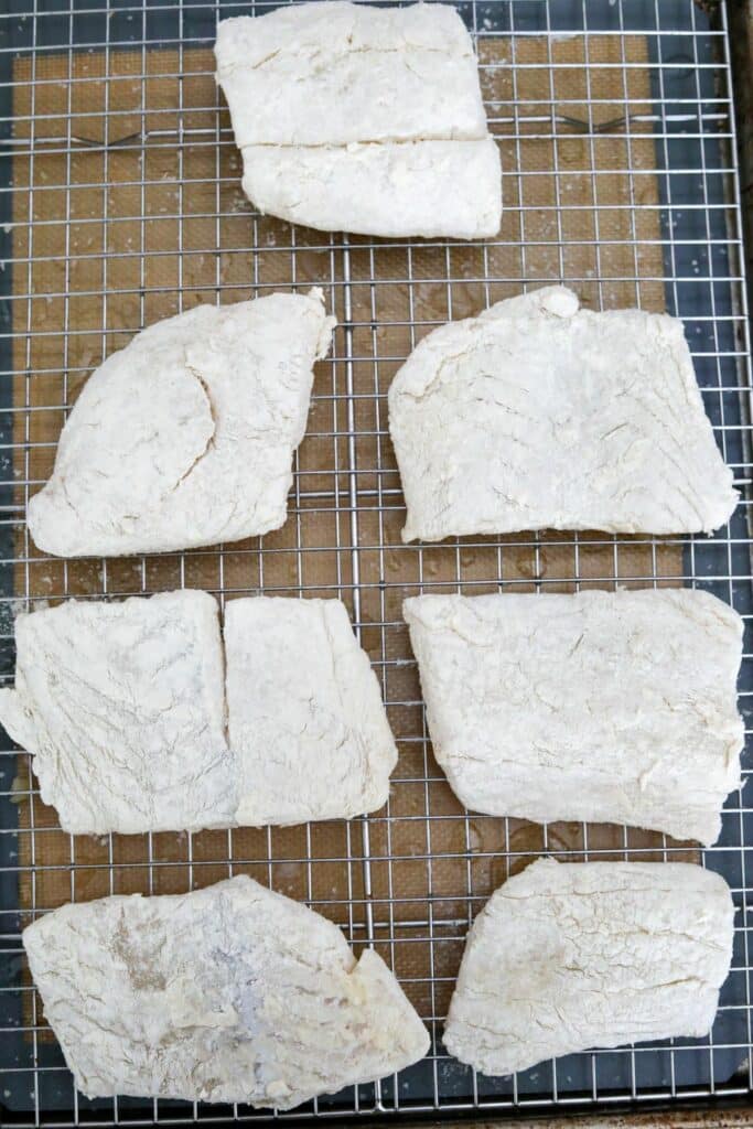 Floured cod on a cooling rack