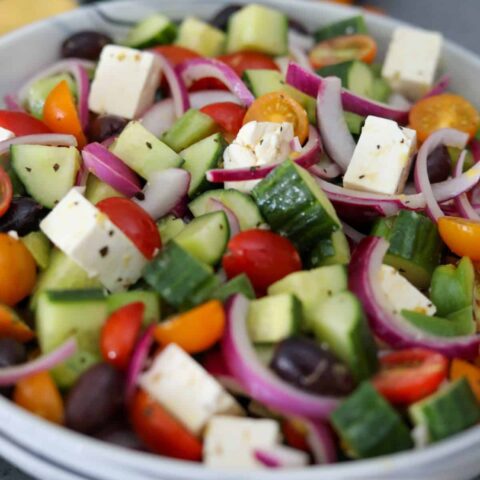 A marble bowl of Greek salad