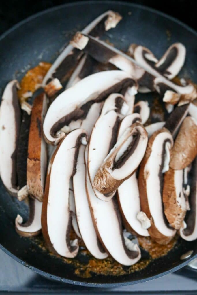 Sliced mushrooms in a pan