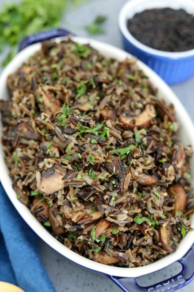 A blue dish with wild rice