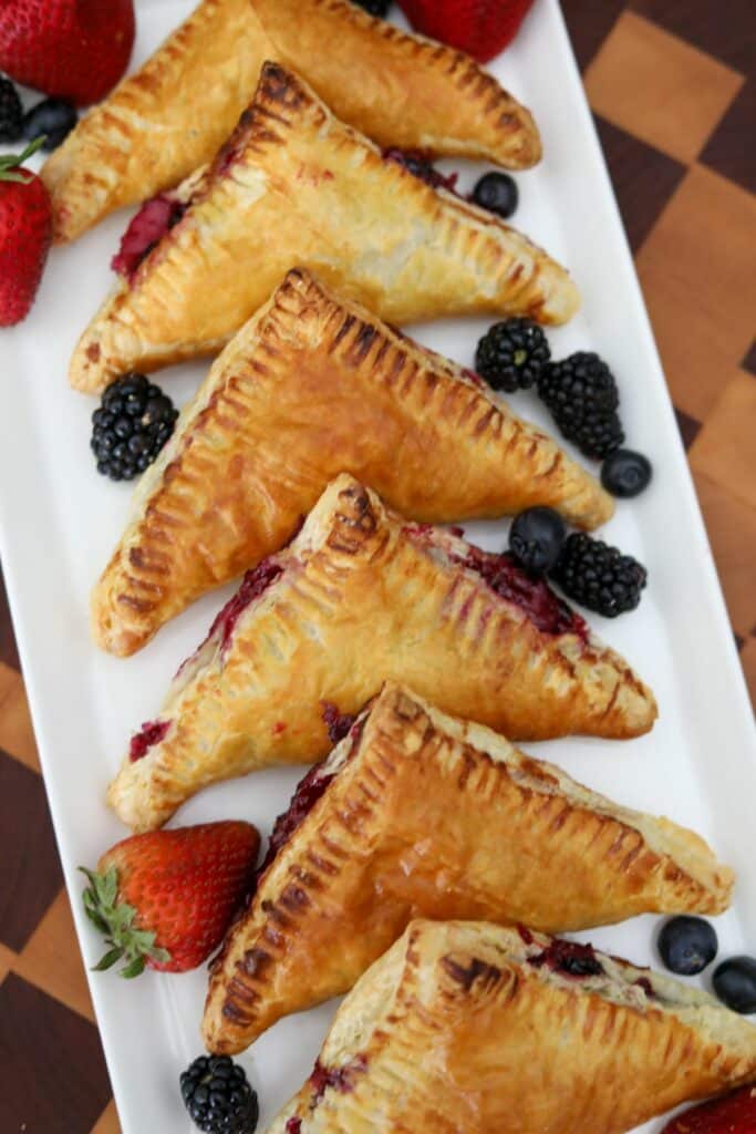 berry turnovers on a white platter