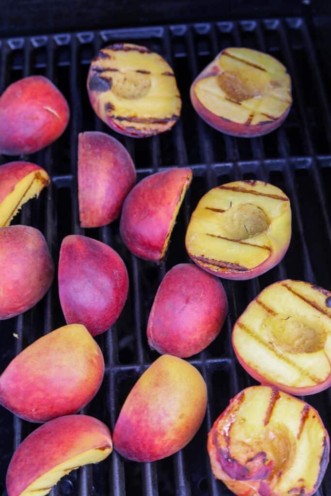 Cooked peaches on a grill