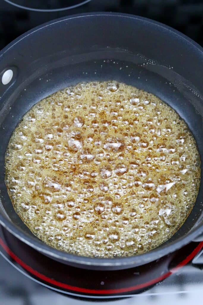 Boiling caramel in a saucepan