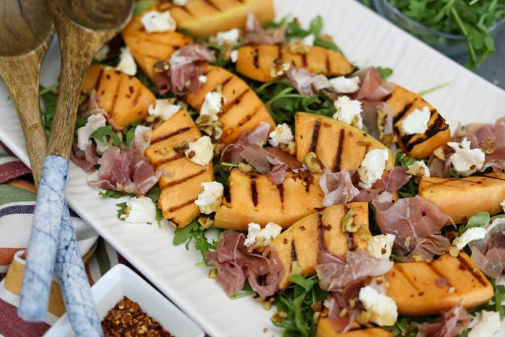 A large platter with grilled cantaloupe salad