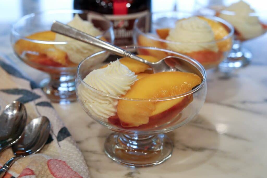 Close up of prosecco peaches with whipped mascarpone