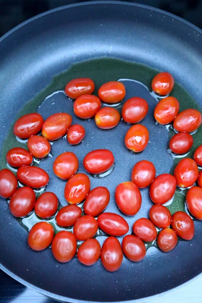 Cherry tomatoes and olive oil in a pan