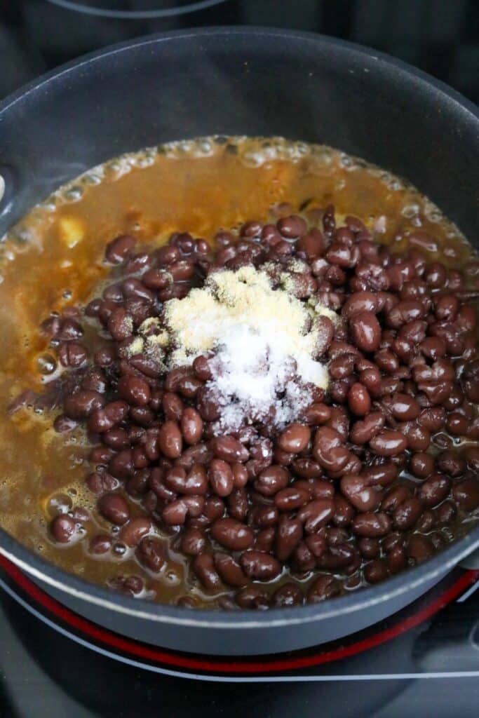 Black beans and spices added to the saucepan