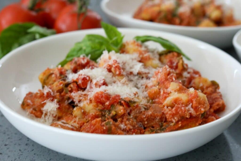 A bowl of tomato and basil gnocchi