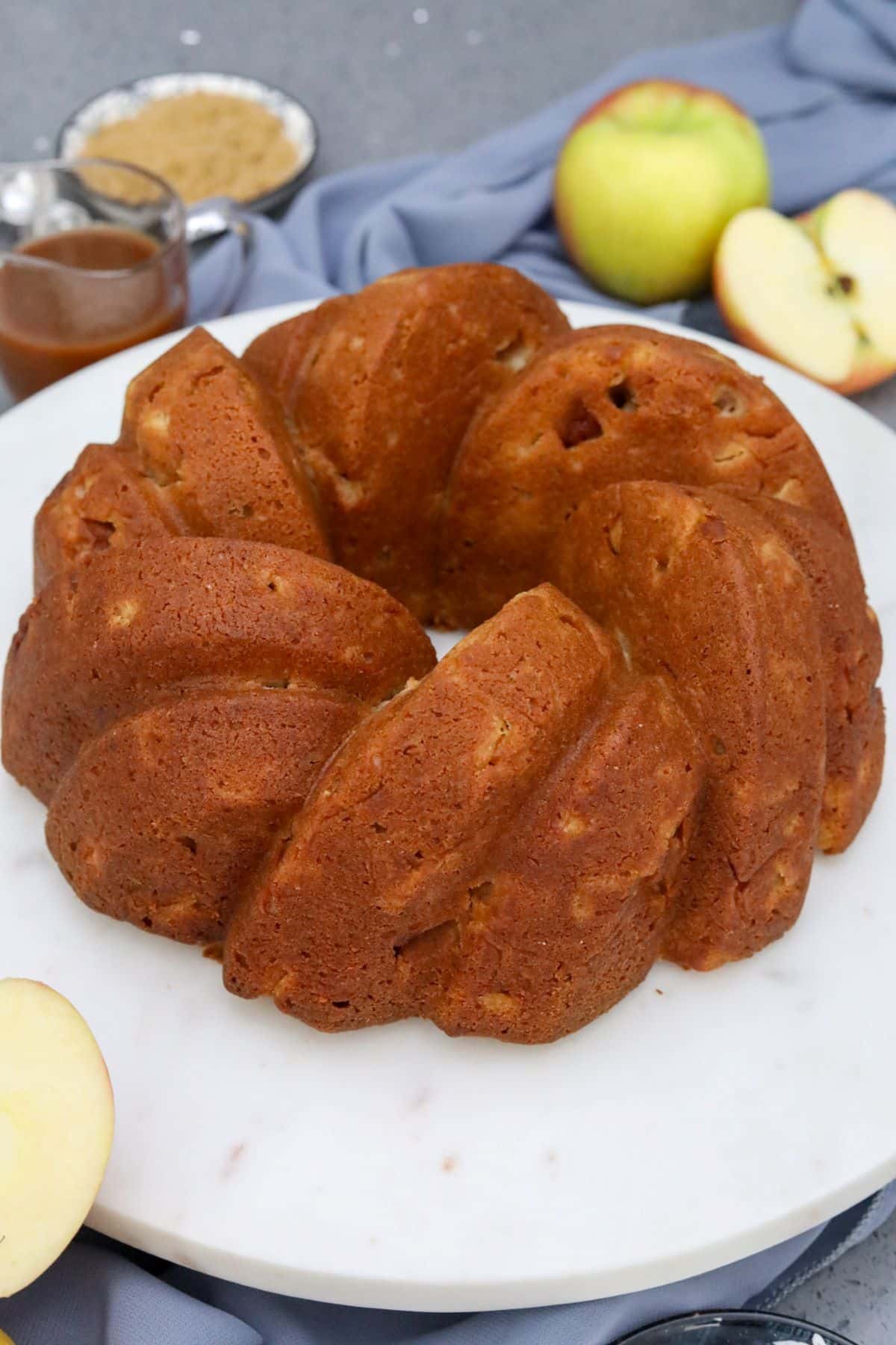Apple cake on a white cake plate