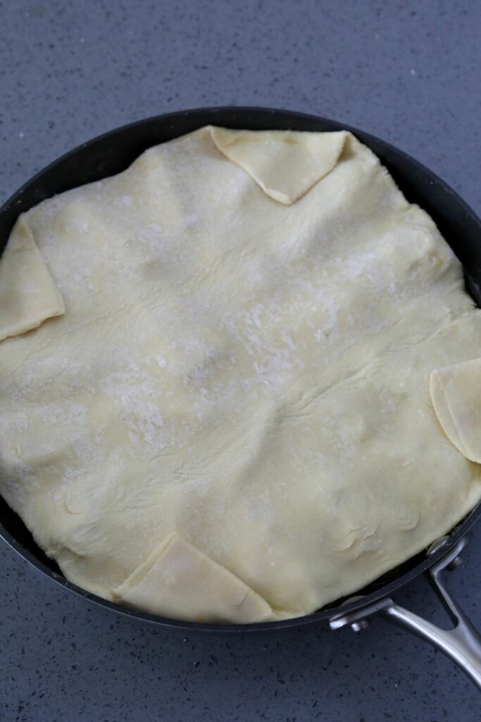 Puff pastry on top of cooked apples