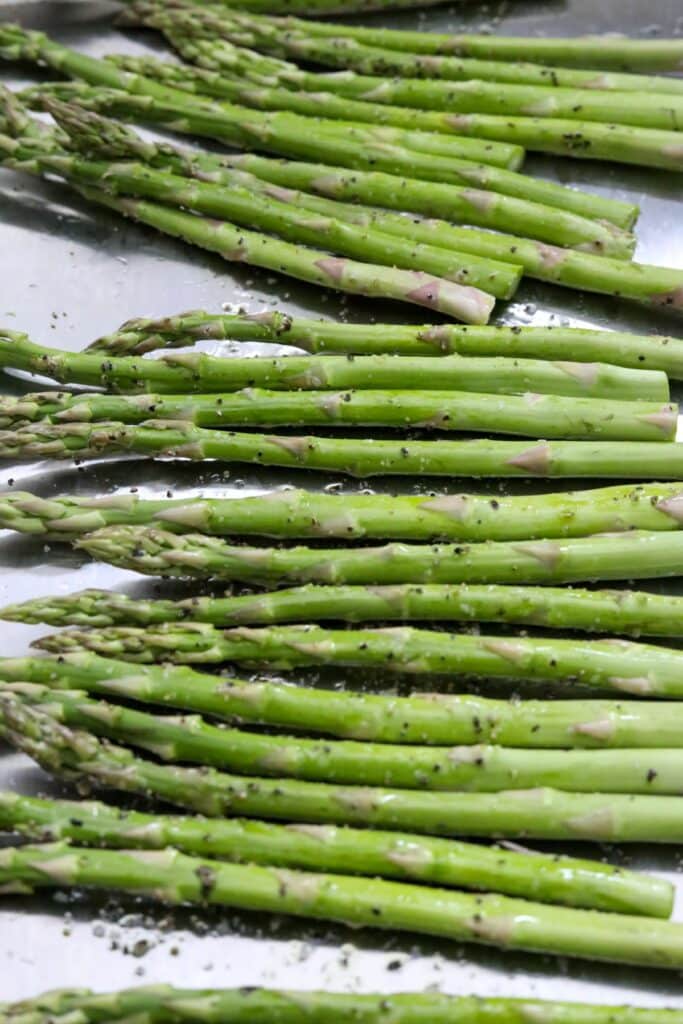 Asparagus on a sheet pan before roasting