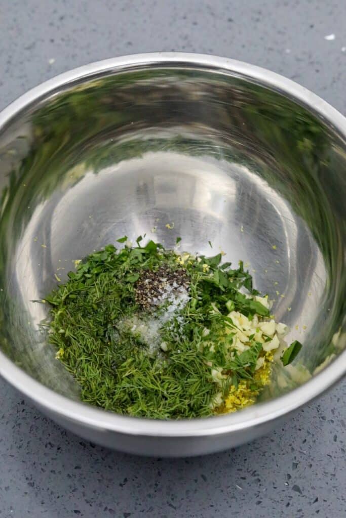 Ingredients for dill chimichurri in a metal bowl