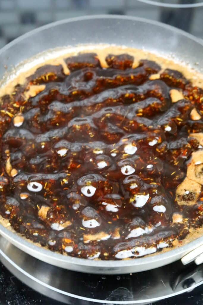 Balsamic glaze bubbling in a pan