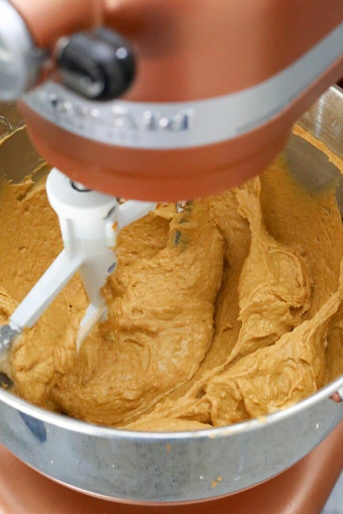 Pumpkin cupcake batter in a mixing bowl
