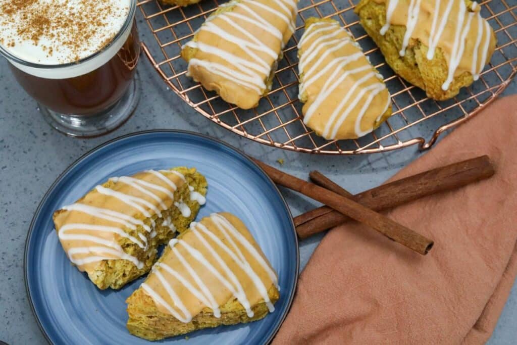 Scones on a plate and on a copper cooling rack
