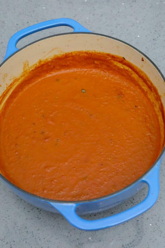 Cooked roasted tomato soup in a Dutch oven
