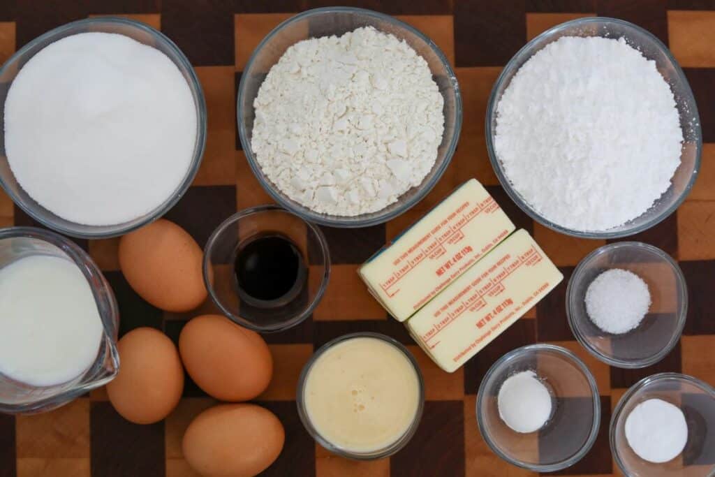 Ingredients for buttermilk cake on a wooden cutting board