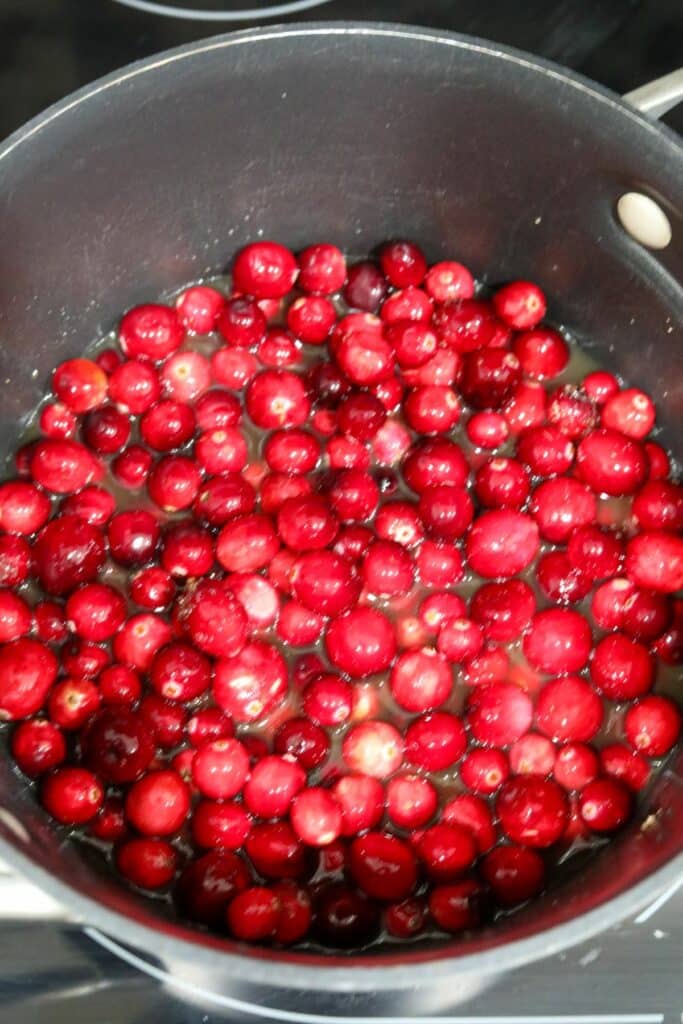 Cranberries cooking in a sauce pan