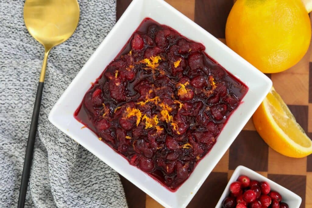 A white bowl with cranberry sauce